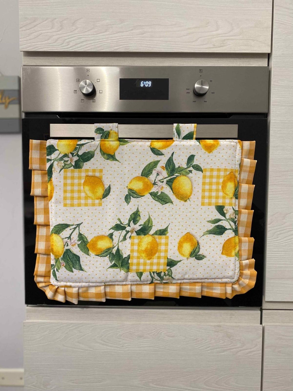 Copriforno fantasia limoni quadrettato